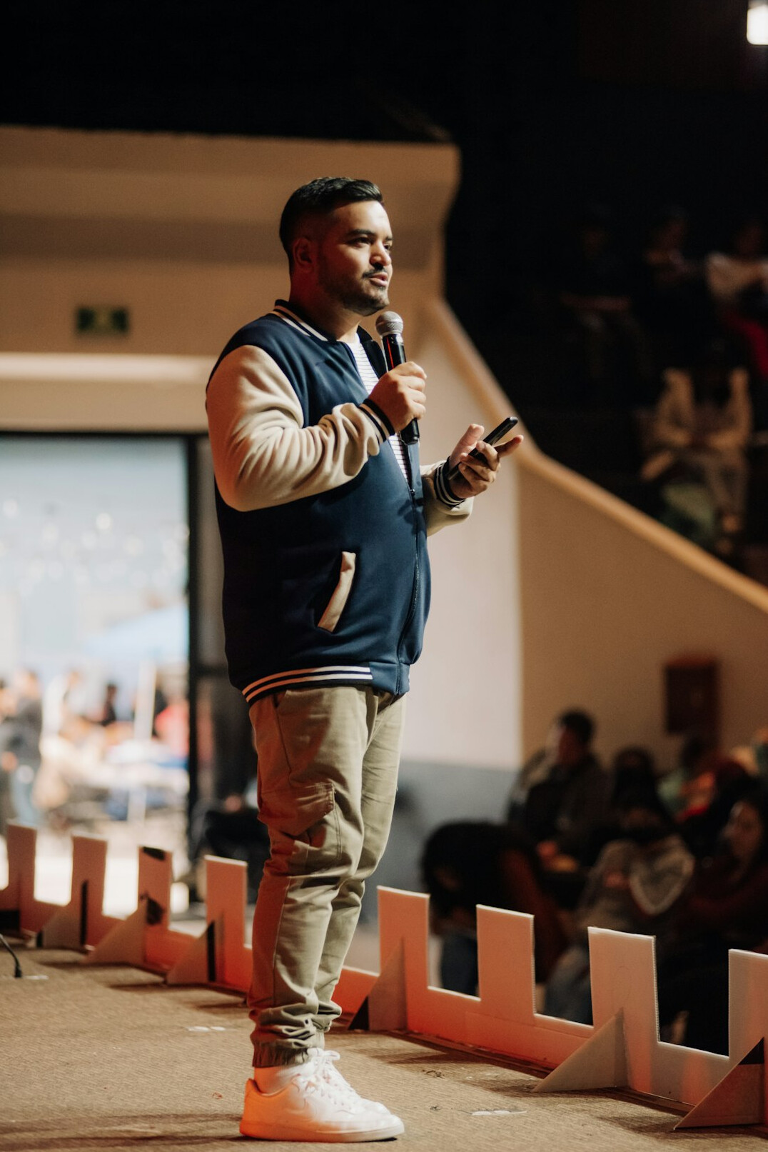 person giving speech on stage