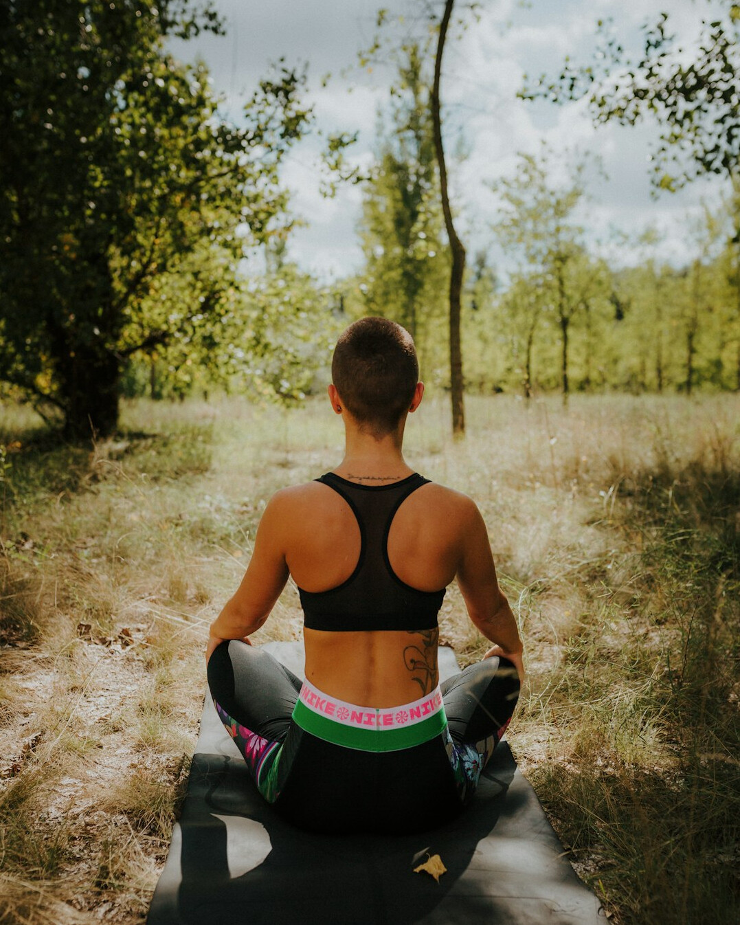 person meditating in nature