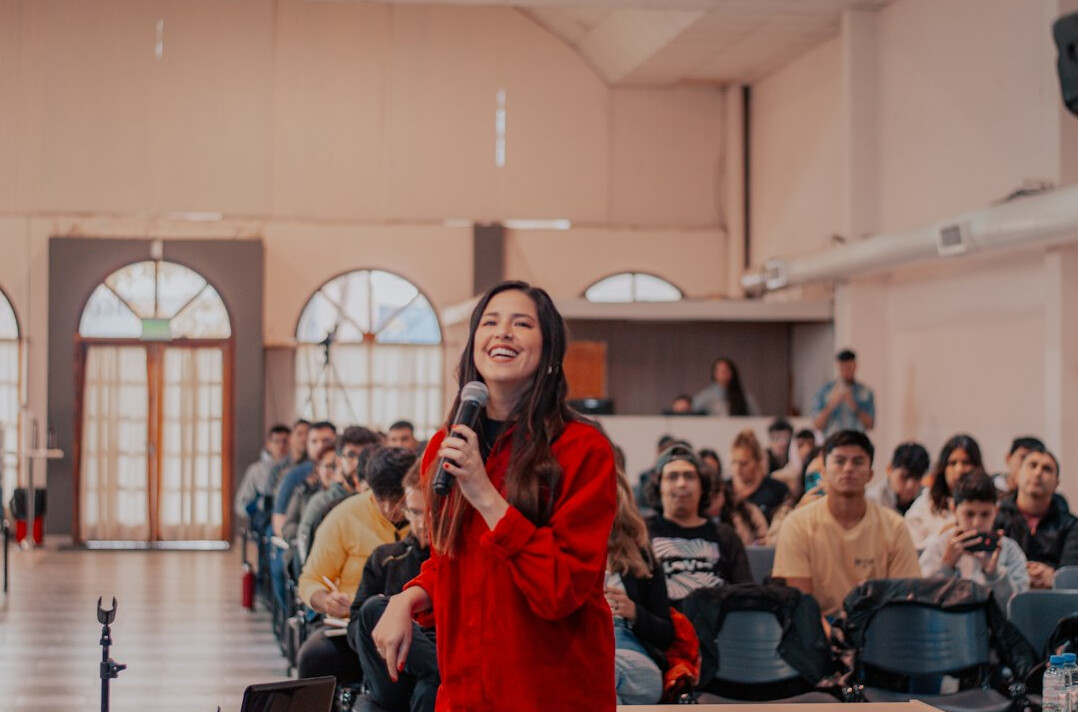 person giving speech on stage